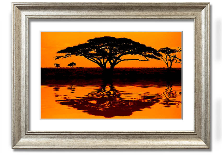 Framed print of an African tree reflection, showcasing vibrant colors and intricate details, ready to hang.