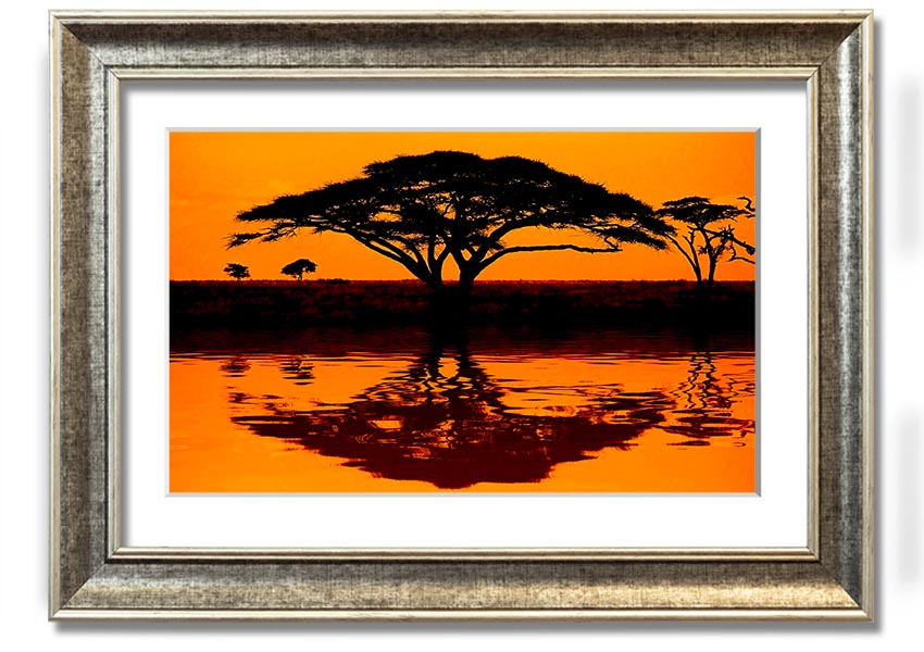 Framed print of an African tree reflection, showcasing vibrant colors and intricate details, ready to hang.