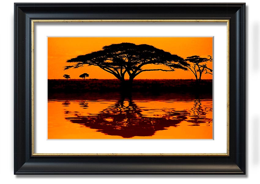 Framed print of an African tree reflection, showcasing vibrant colors and intricate details, ready to hang.