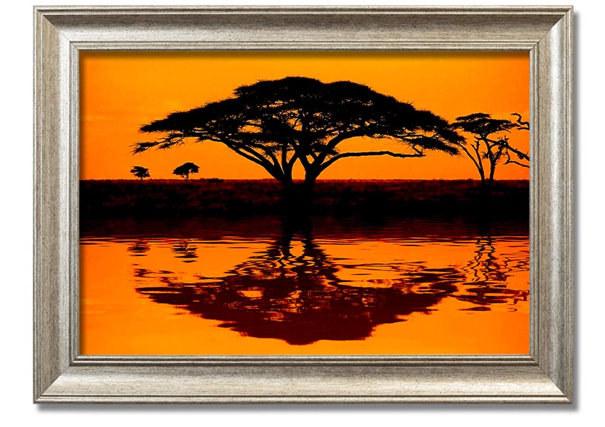 Framed print of an African tree reflection, showcasing vibrant colors and intricate details, ready to hang.