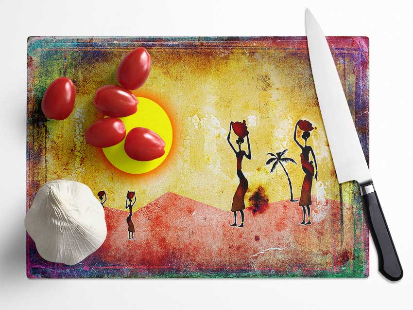 A beautifully designed chopping board featuring African Tribal Art, made from tempered glass with a chinchilla ripple effect and anti-slip feet.