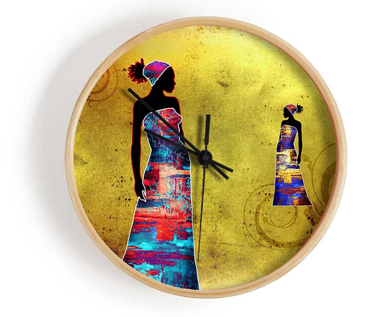 A stylish African Tribal Art clock made from natural bamboo, featuring a round face and clear Plexiglas lens, available in black, white, and natural frame colors.