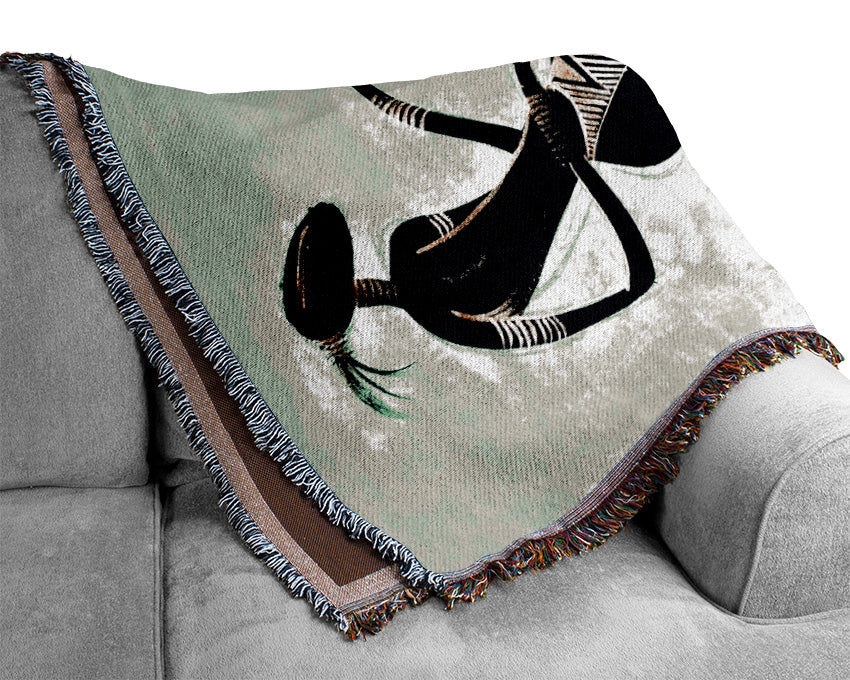 A beautifully designed African Tribal Dancer throw blanket made from 100% cotton, featuring intricate tribal patterns and a luxurious finish.