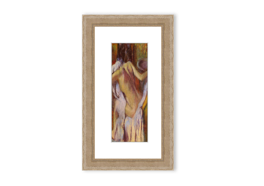 Framed print of After Bathing #4 by Degas, showcasing soft colors and elegant design, ready to hang.