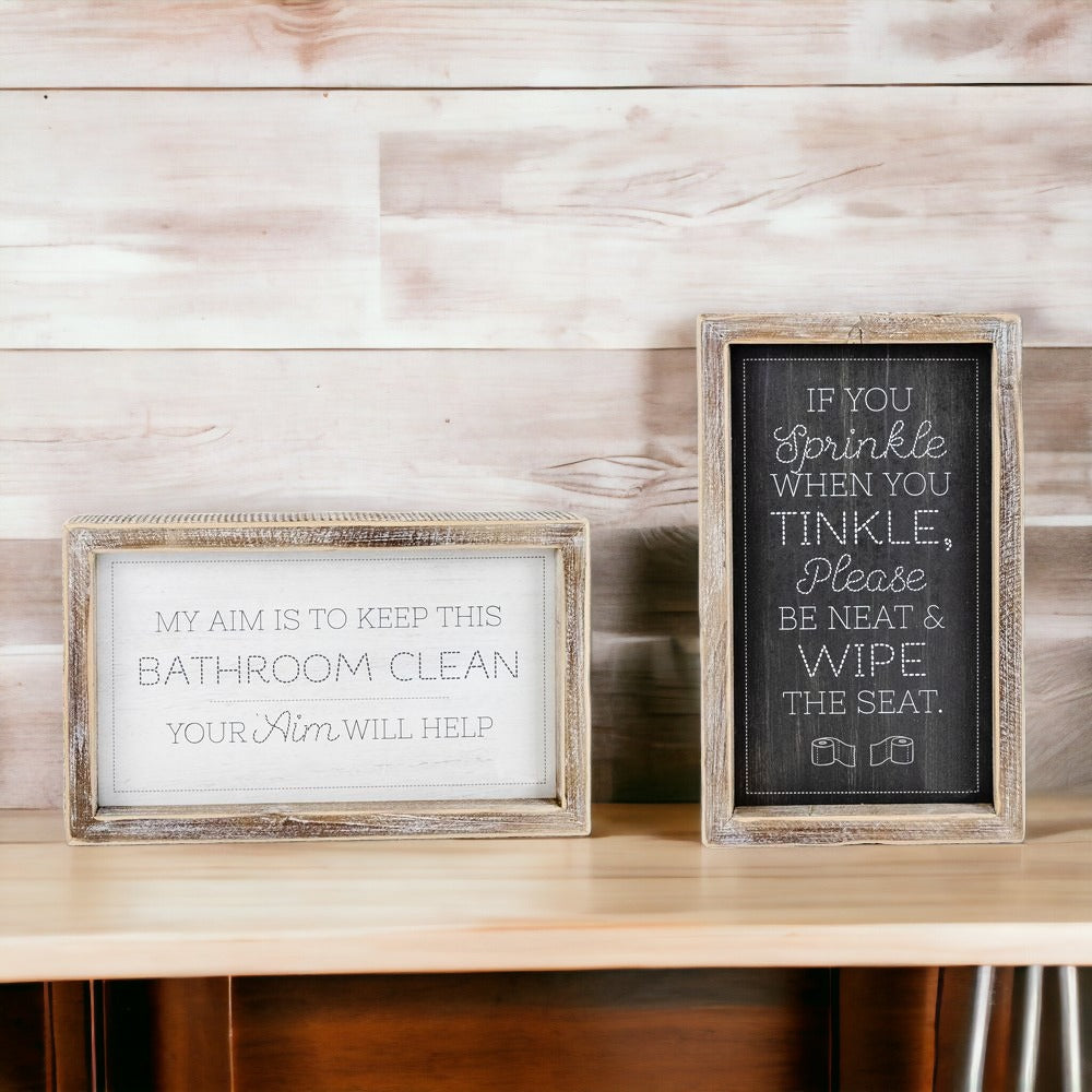 Aim + Sprinkle Tinkle double-sided bathroom sign with wooden frame, featuring humorous cleanliness messages.