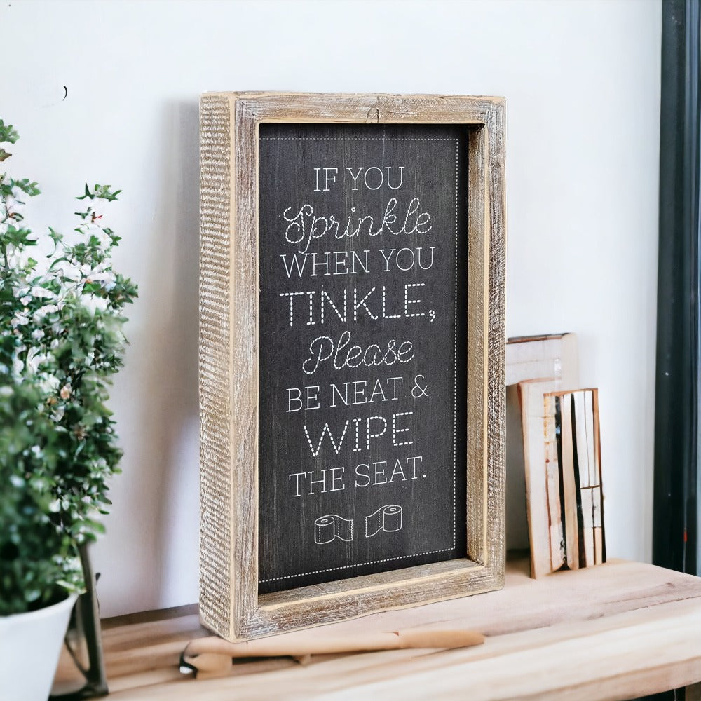 Aim + Sprinkle Tinkle double-sided bathroom sign with wooden frame, featuring humorous cleanliness messages.