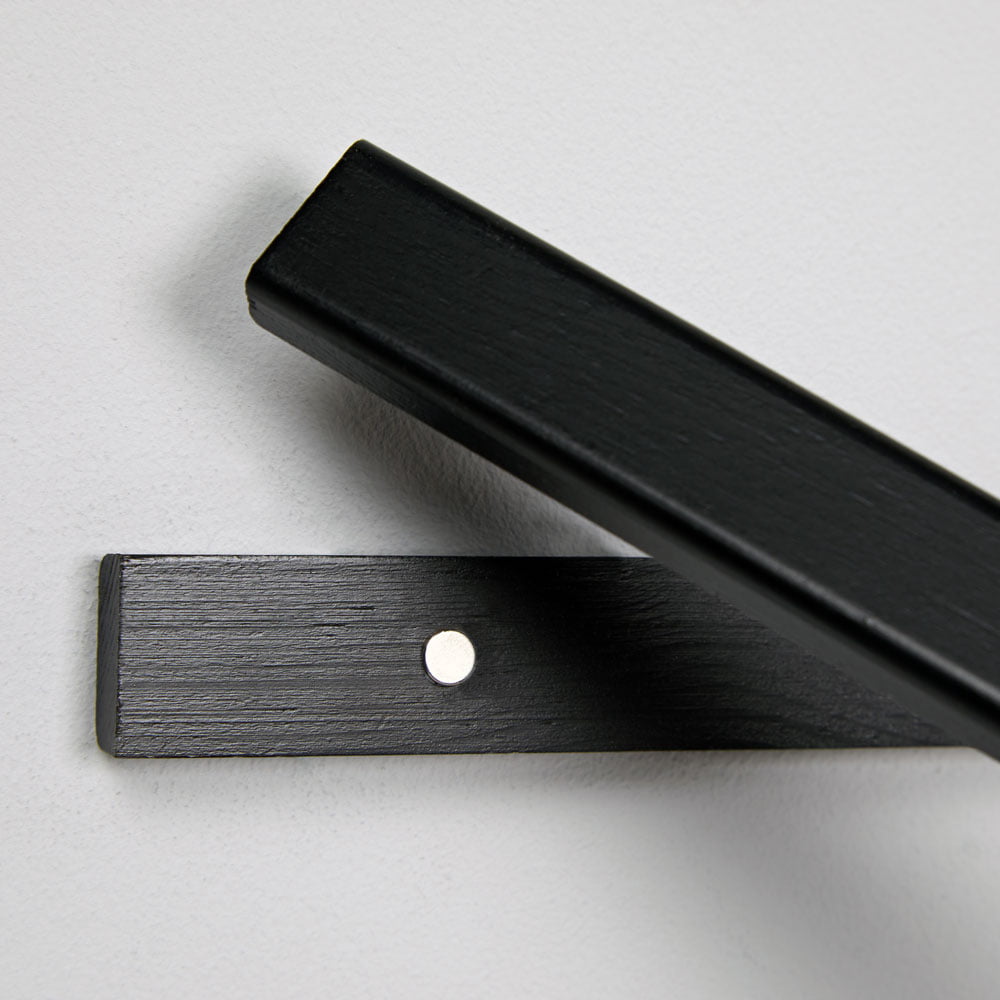 Air Service slimline wooden poster hangers in black, white, and natural oak, showcasing a modern design with magnetic fastening.