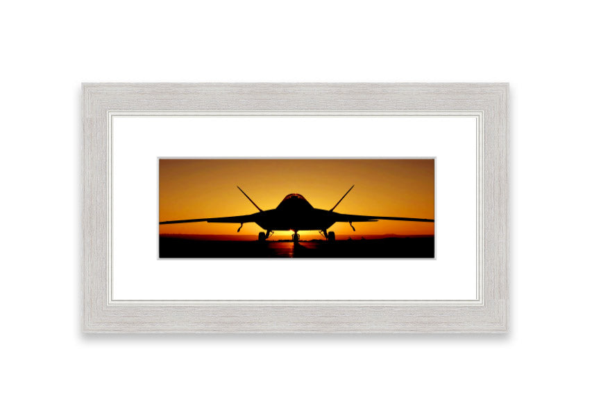 Framed print of an airplane at sunset, showcasing vibrant colors and a serene landscape.