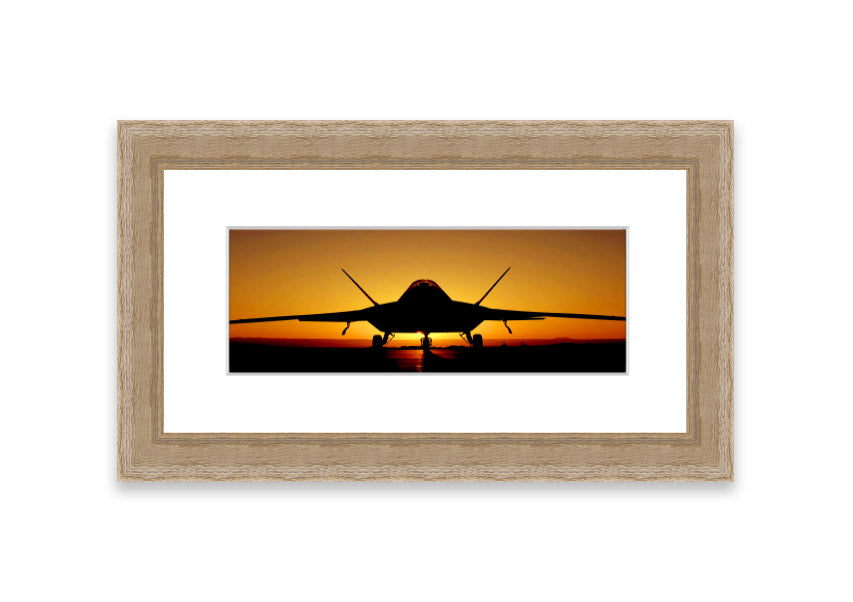 Framed print of an airplane at sunset, showcasing vibrant colors and a serene landscape.