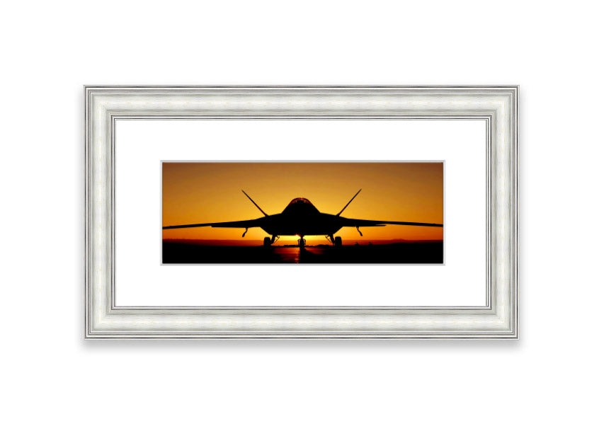 Framed print of an airplane at sunset, showcasing vibrant colors and a serene landscape.