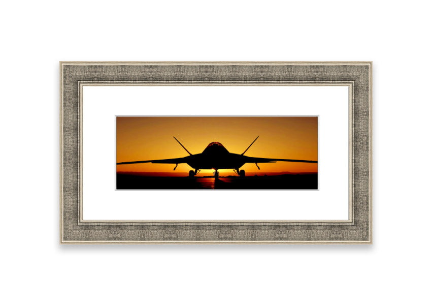 Framed print of an airplane at sunset, showcasing vibrant colors and a serene landscape.