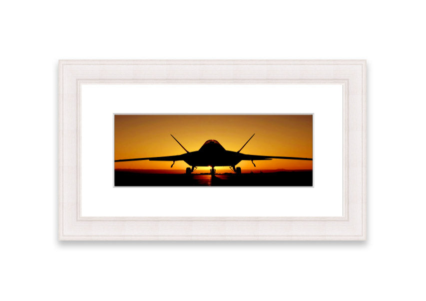 Framed print of an airplane at sunset, showcasing vibrant colors and a serene landscape.