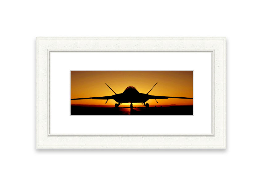 Framed print of an airplane at sunset, showcasing vibrant colors and a serene landscape.