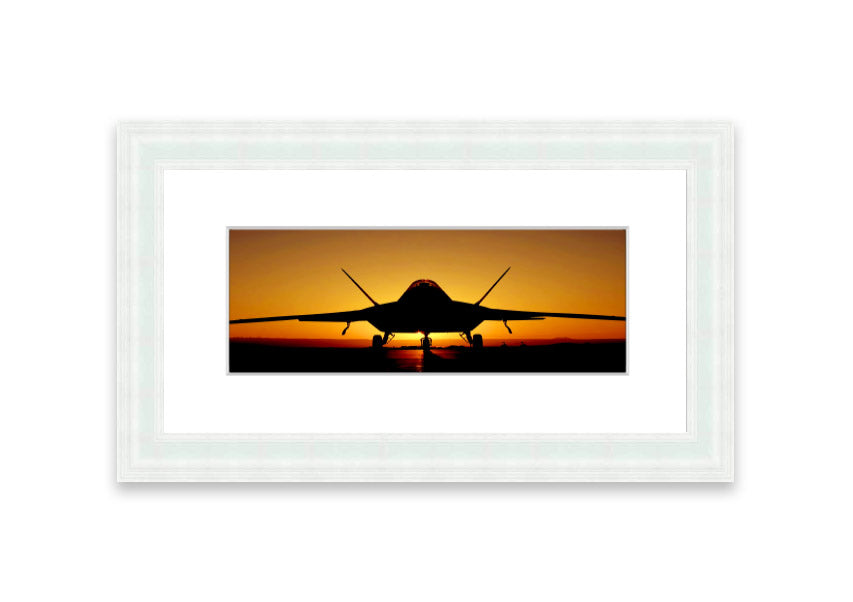 Framed print of an airplane at sunset, showcasing vibrant colors and a serene landscape.