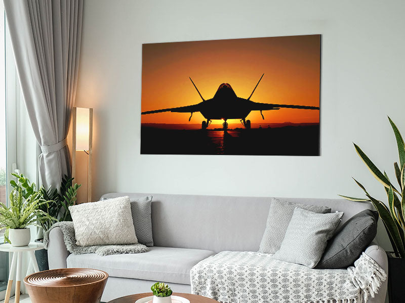 A stunning artwork of an airplane silhouetted against a vibrant sunset, printed on brushed aluminium dibond.