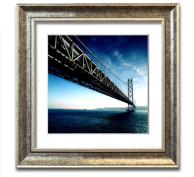 Square framed print of the Akashi Kaikyo Bridge in Japan, showcasing its stunning architecture and scenic backdrop.