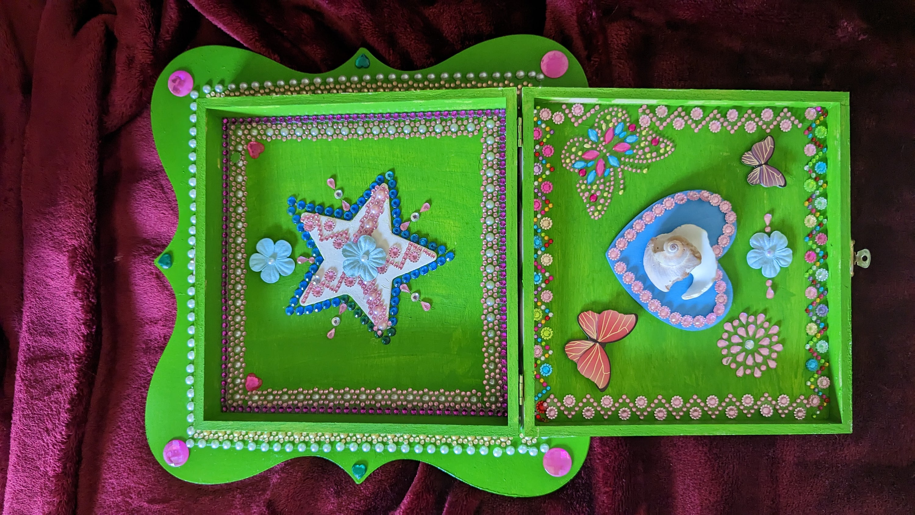 A beautifully hand-decorated Wish Box by Sharon Tatem featuring a powerful maiden, symbolizing dreams and aspirations.