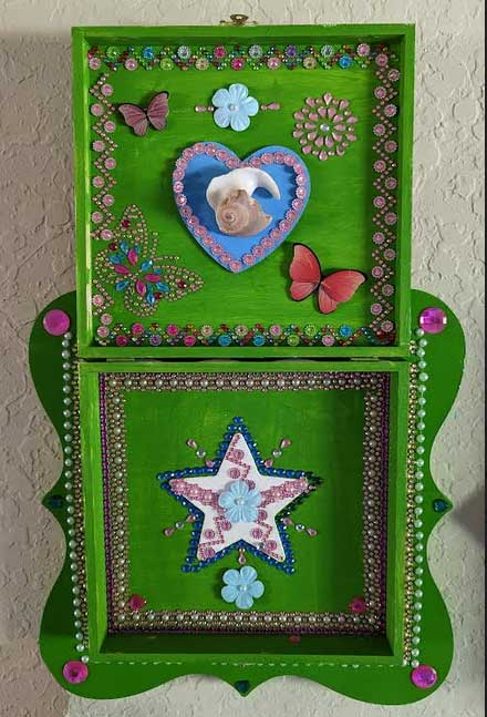 A beautifully hand-decorated Wish Box by Sharon Tatem featuring a powerful maiden, symbolizing dreams and aspirations.