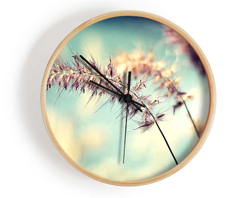 A stylish bamboo wall clock with a round face, available in black, white, and natural frame colors, featuring a clear Plexiglas lens.