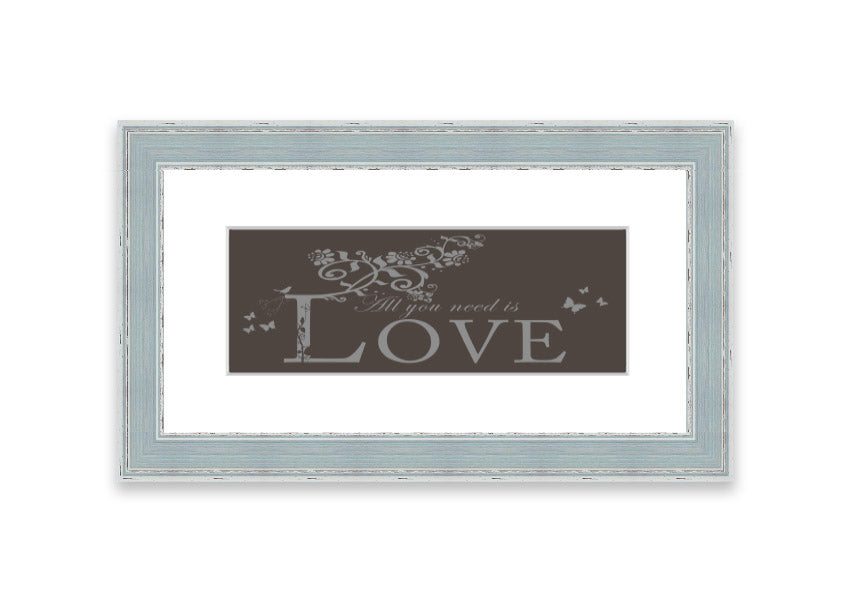 Framed print of All You Need Is Love Chocolate, showcasing vibrant colors and a heartwarming message, ready to hang.