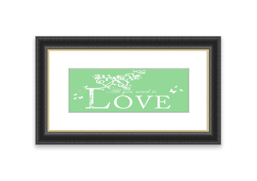 Framed print of 'All You Need Is Love' in green, showcasing vibrant colors and a heartfelt message, ready to hang.