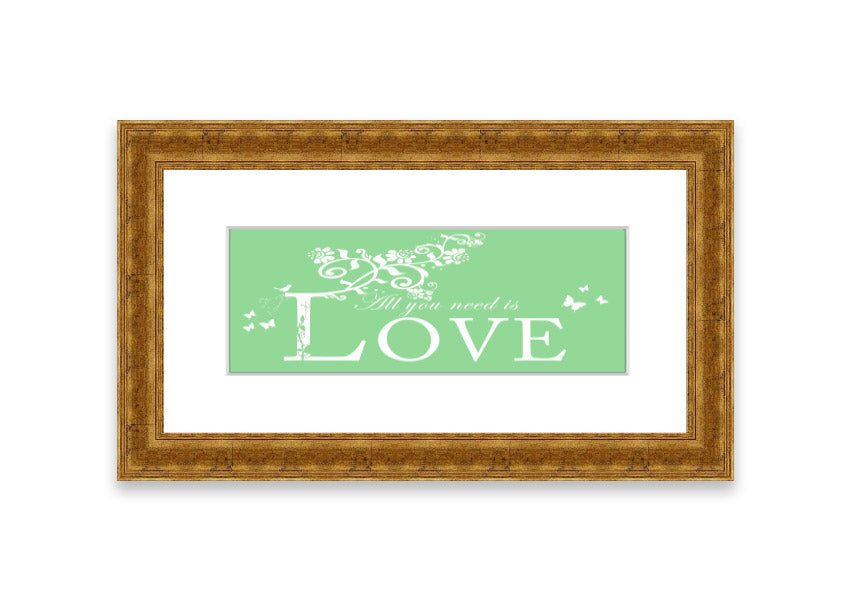 Framed print of 'All You Need Is Love' in green, showcasing vibrant colors and a heartfelt message, ready to hang.