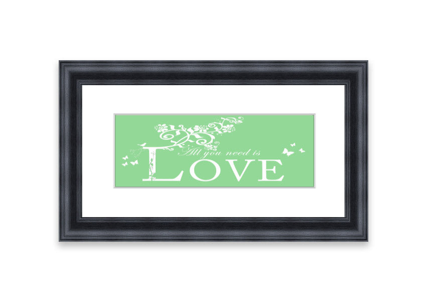 Framed print of 'All You Need Is Love' in green, showcasing vibrant colors and a heartfelt message, ready to hang.