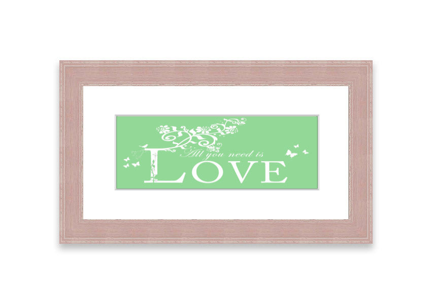 Framed print of 'All You Need Is Love' in green, showcasing vibrant colors and a heartfelt message, ready to hang.