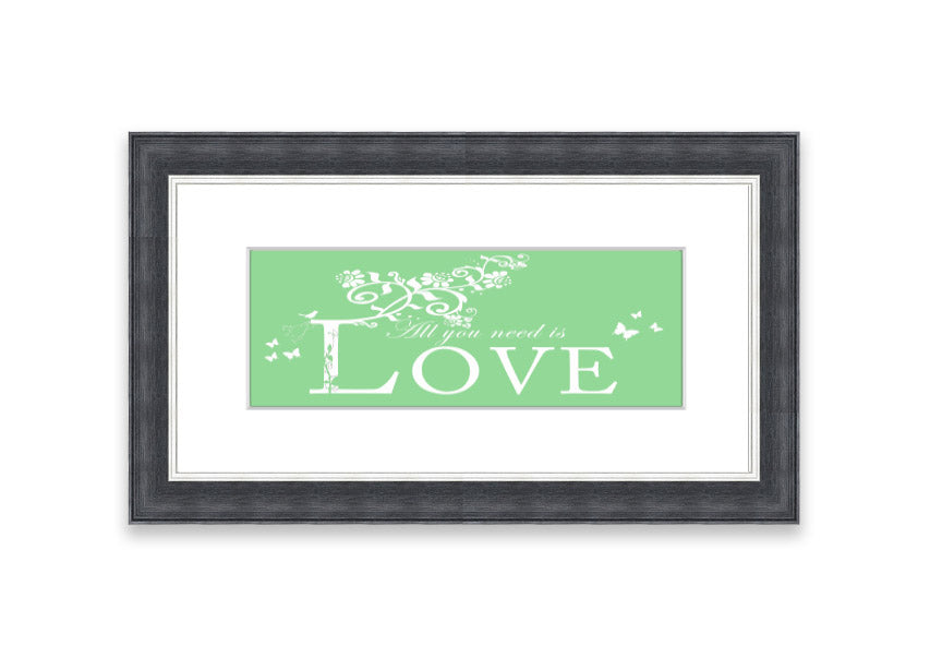 Framed print of 'All You Need Is Love' in green, showcasing vibrant colors and a heartfelt message, ready to hang.