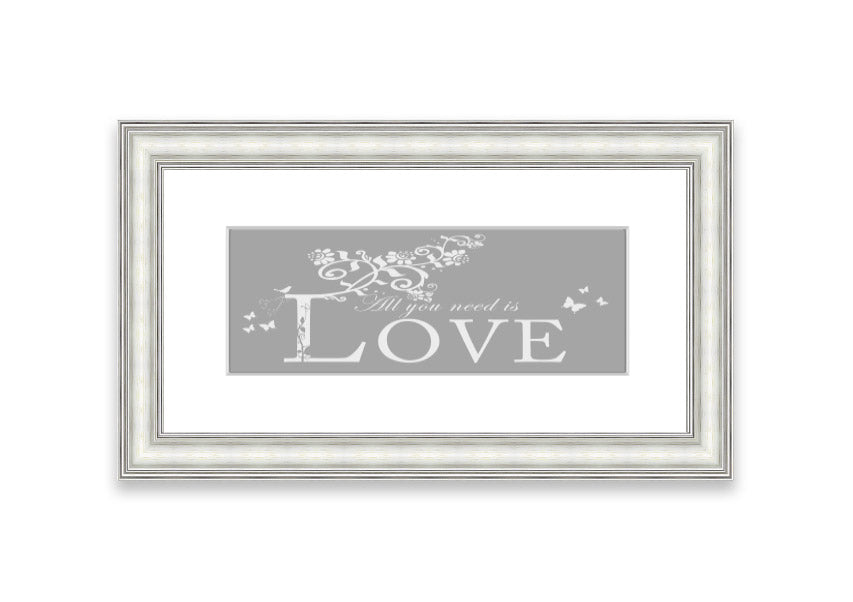 Framed print featuring the phrase 'All You Need Is Love' in grey and white, handmade in the UK.