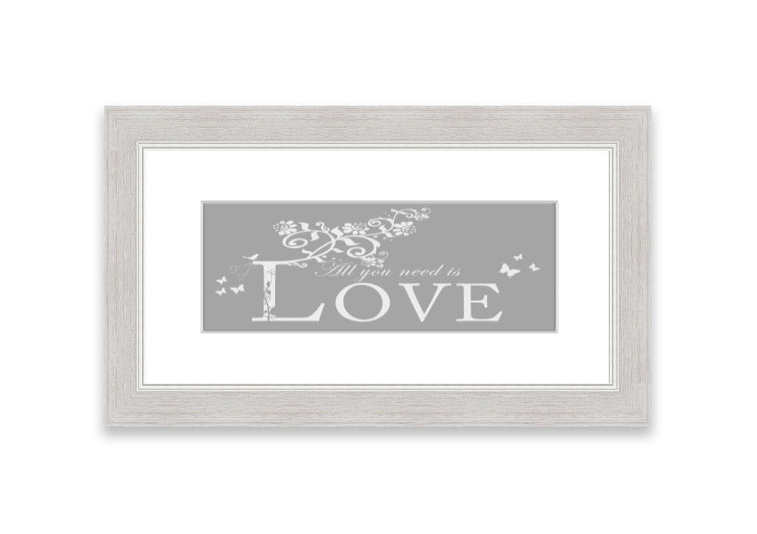 Framed print featuring the phrase 'All You Need Is Love' in grey and white, handmade in the UK.