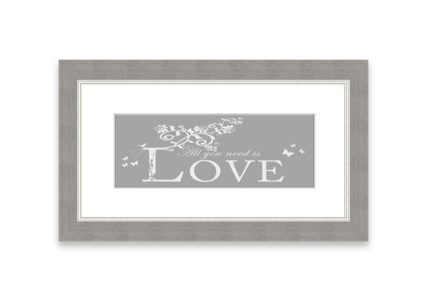 Framed print featuring the phrase 'All You Need Is Love' in grey and white, handmade in the UK.