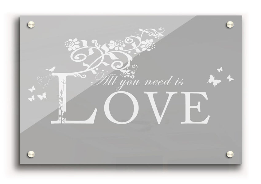 All You Need Is Love Grey White acrylic print on a wall, showcasing its elegant design and vibrant colors.