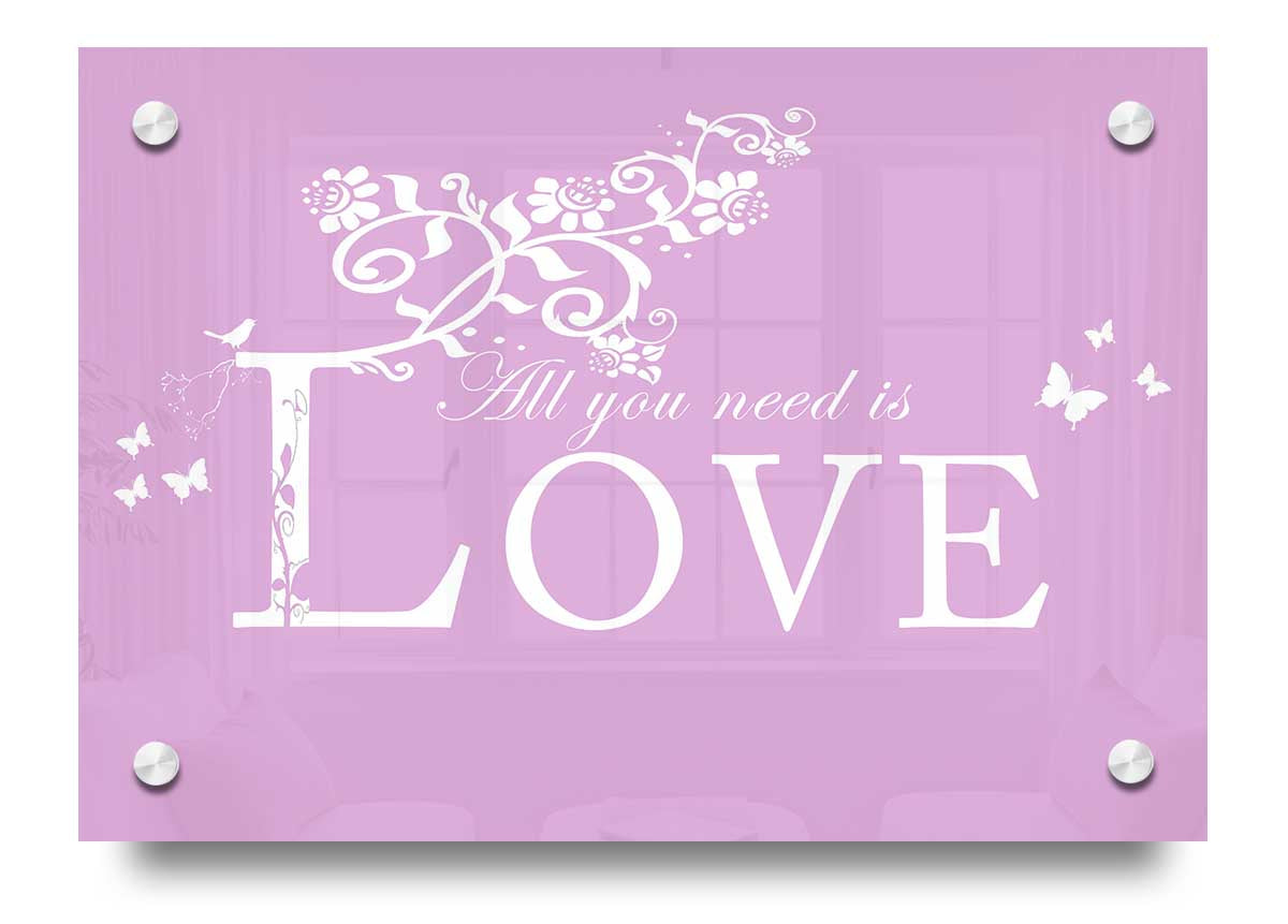 All You Need Is Love Pink acrylic print on a wall, showcasing vibrant pink colors and modern design.