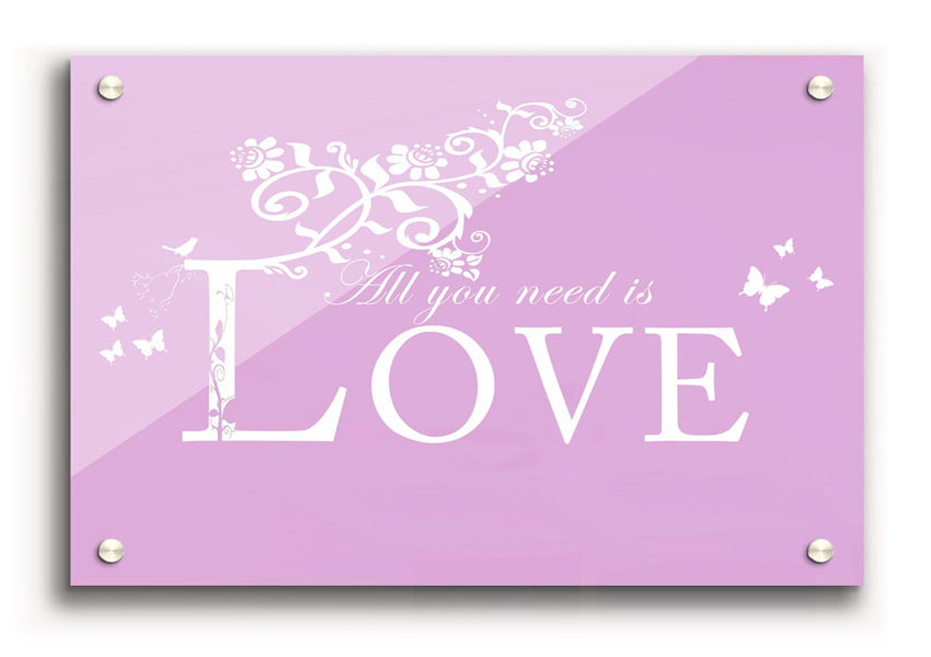 All You Need Is Love Pink acrylic print on a wall, showcasing vibrant pink colors and modern design.