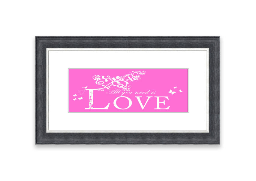 A vibrant pink framed print featuring the phrase 'All You Need Is Love', handmade in the UK, ready to hang.