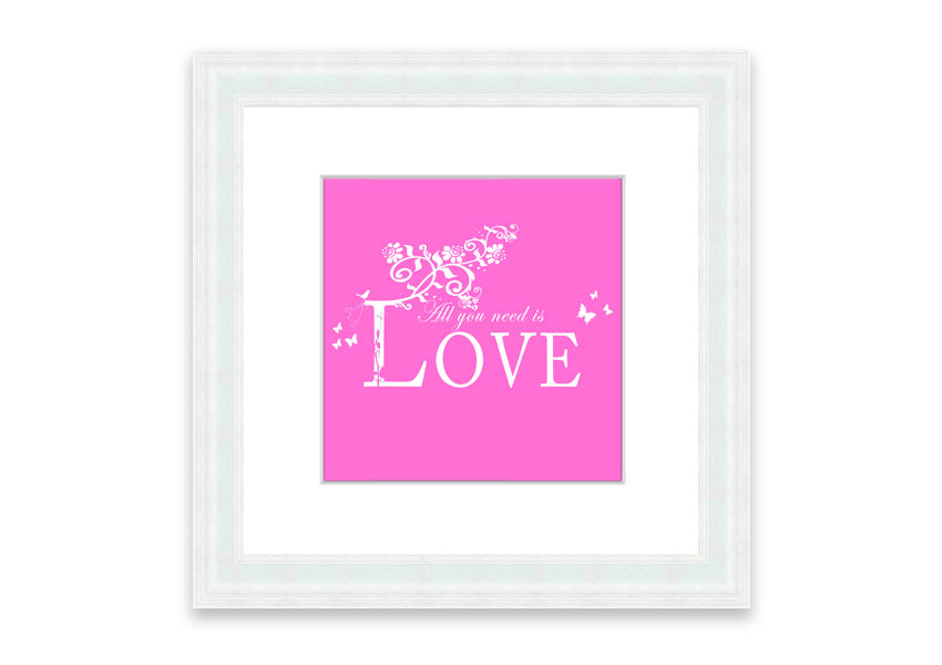 A vibrant pink framed print featuring the phrase 'All You Need Is Love', handmade in the UK, ready to hang.