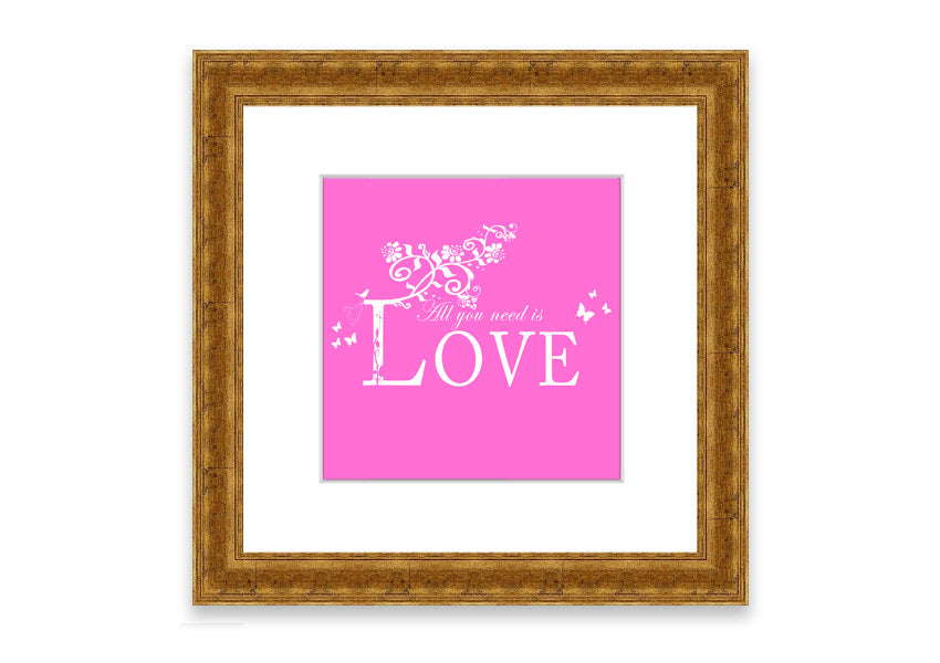 A vibrant pink framed print featuring the phrase 'All You Need Is Love', handmade in the UK, ready to hang.