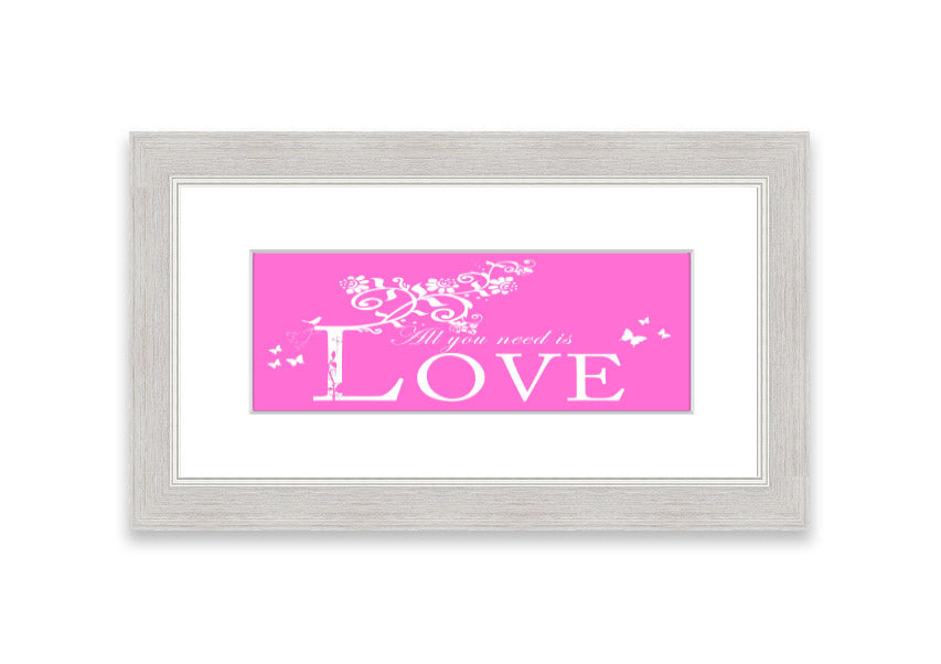 A vibrant pink framed print featuring the phrase 'All You Need Is Love', handmade in the UK, ready to hang.