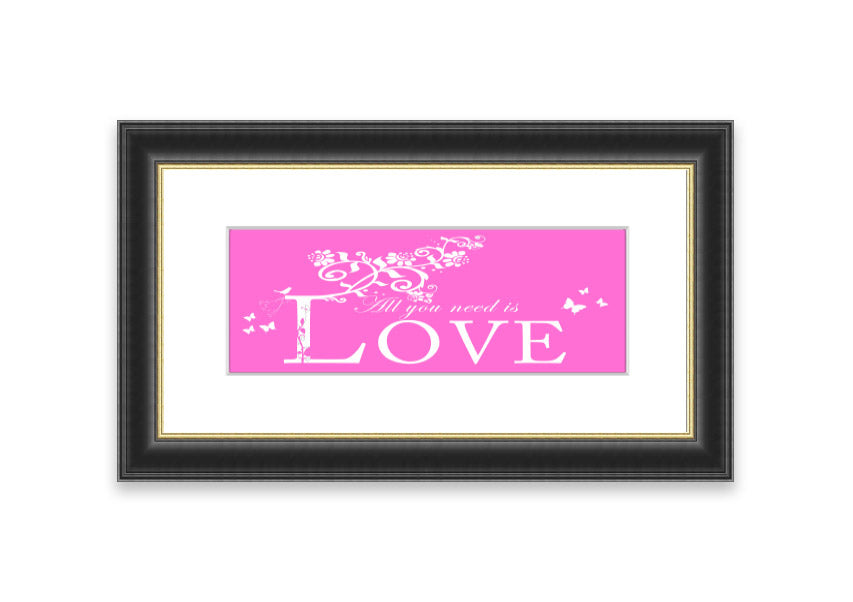 A vibrant pink framed print featuring the phrase 'All You Need Is Love', handmade in the UK, ready to hang.