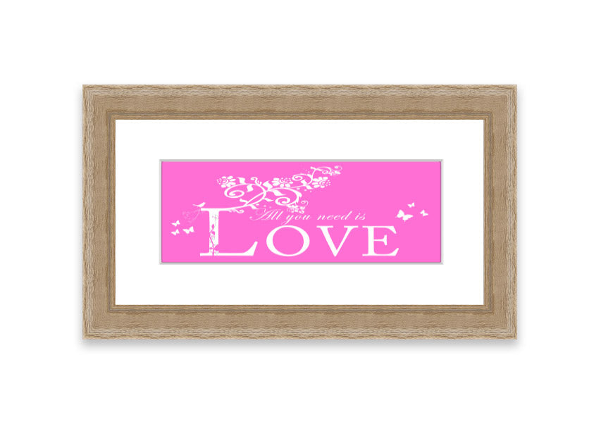 A vibrant pink framed print featuring the phrase 'All You Need Is Love', handmade in the UK, ready to hang.