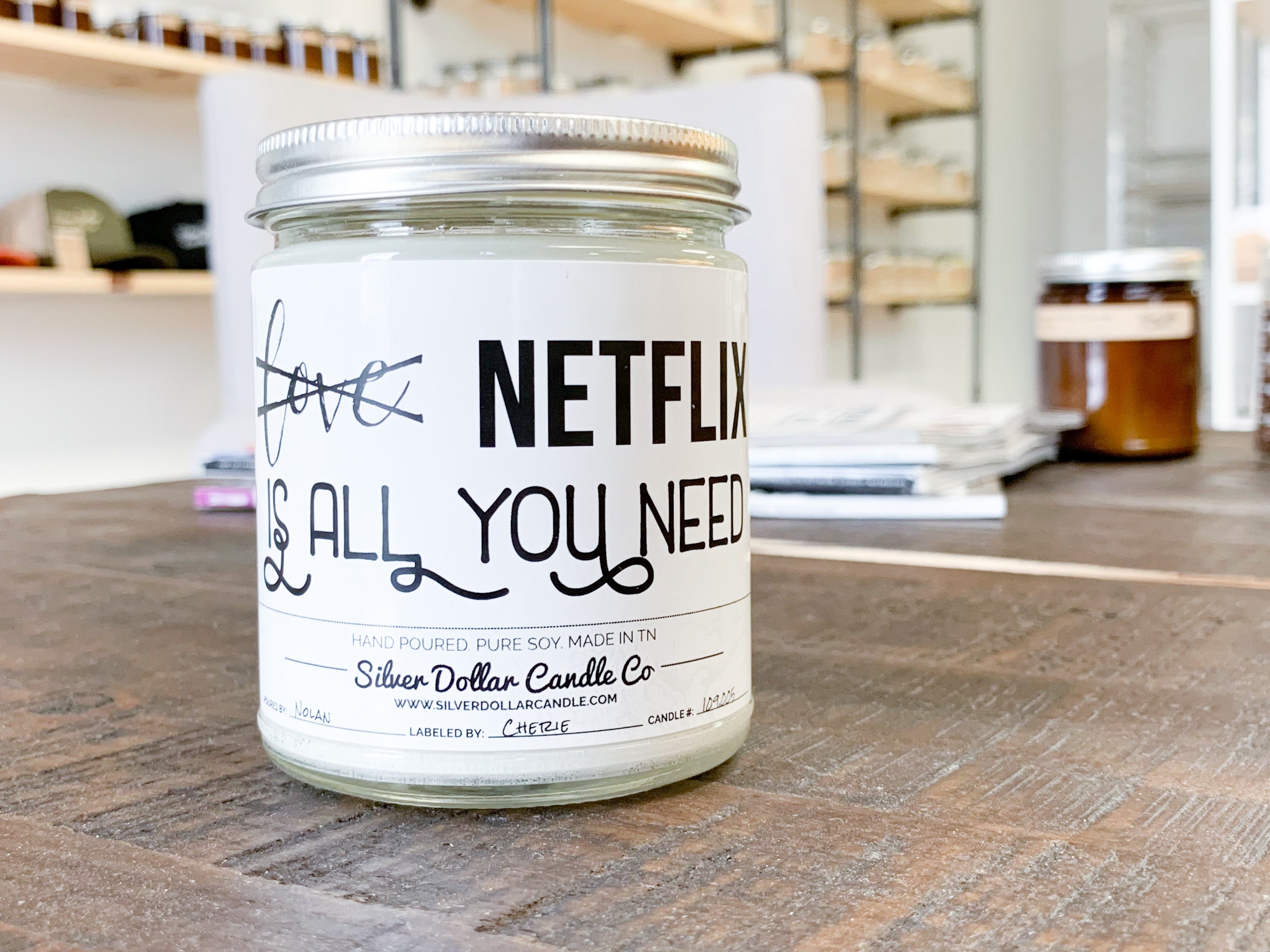 All You Need Is Netflix Soy Candle in a decorative box, showcasing its beautiful design and personalized lid option.