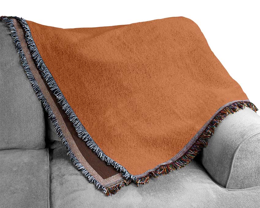 Luxurious cotton throw blanket in a cozy living room setting, showcasing its thermal weave and elegant design.