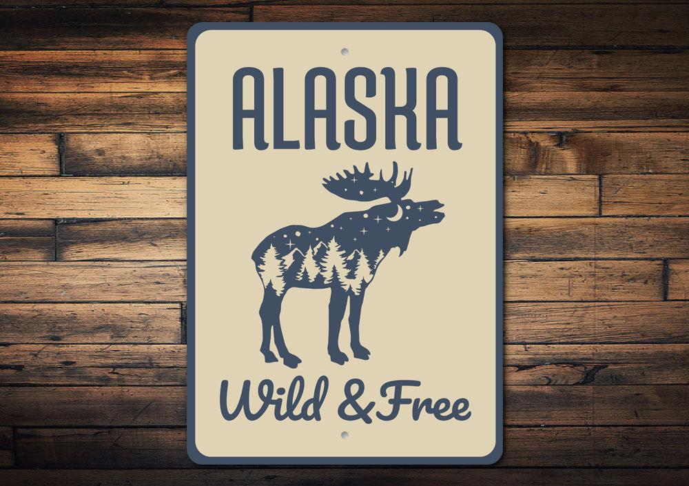 Alaska Wild and Free Sign made of high-quality aluminum, featuring a rustic design perfect for home decor.