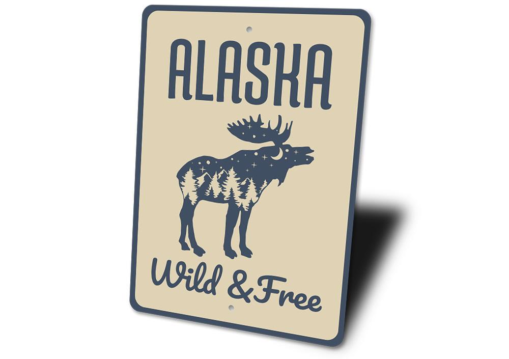 Alaska Wild and Free Sign made of high-quality aluminum, featuring a rustic design perfect for home decor.