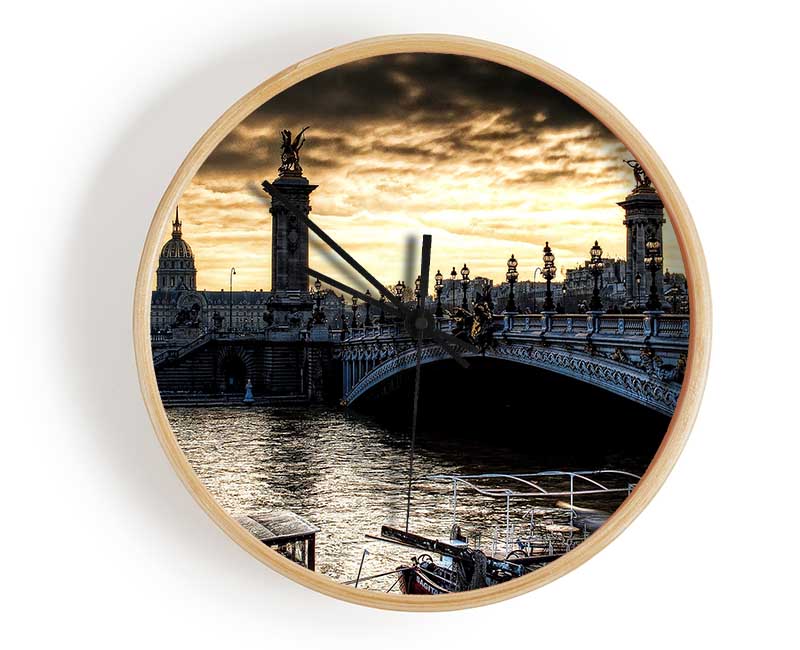 Alexander Bridge Paris clock made from natural bamboo with a round face and clear Plexiglas lens, available in black, white, and natural frame colors.