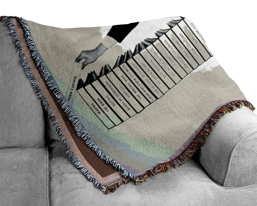 A cozy throw blanket featuring the Alfred Hitchcock Library of Films, made from 100% cotton with a luxurious thermal weave.