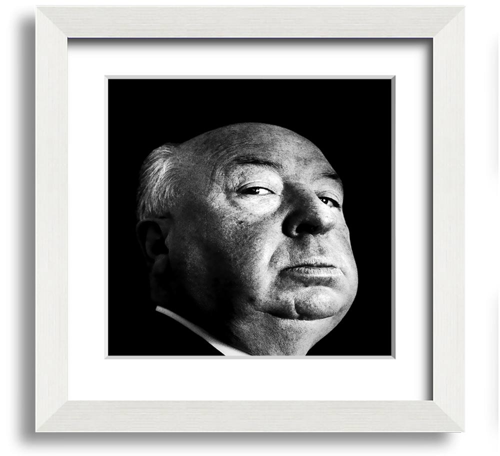 A square framed print of Alfred Hitchcock, showcasing his iconic profile in a stylish frame, available in various colors.