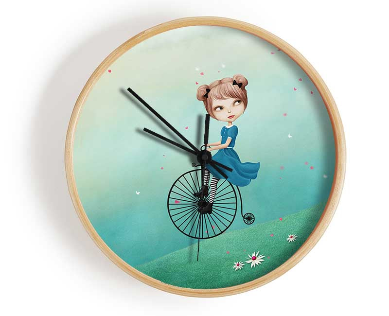 Alice In Wonderland Penny Farthing clock made of natural bamboo with a round face and clear Plexiglas lens, available in black, white, and natural frame colors.