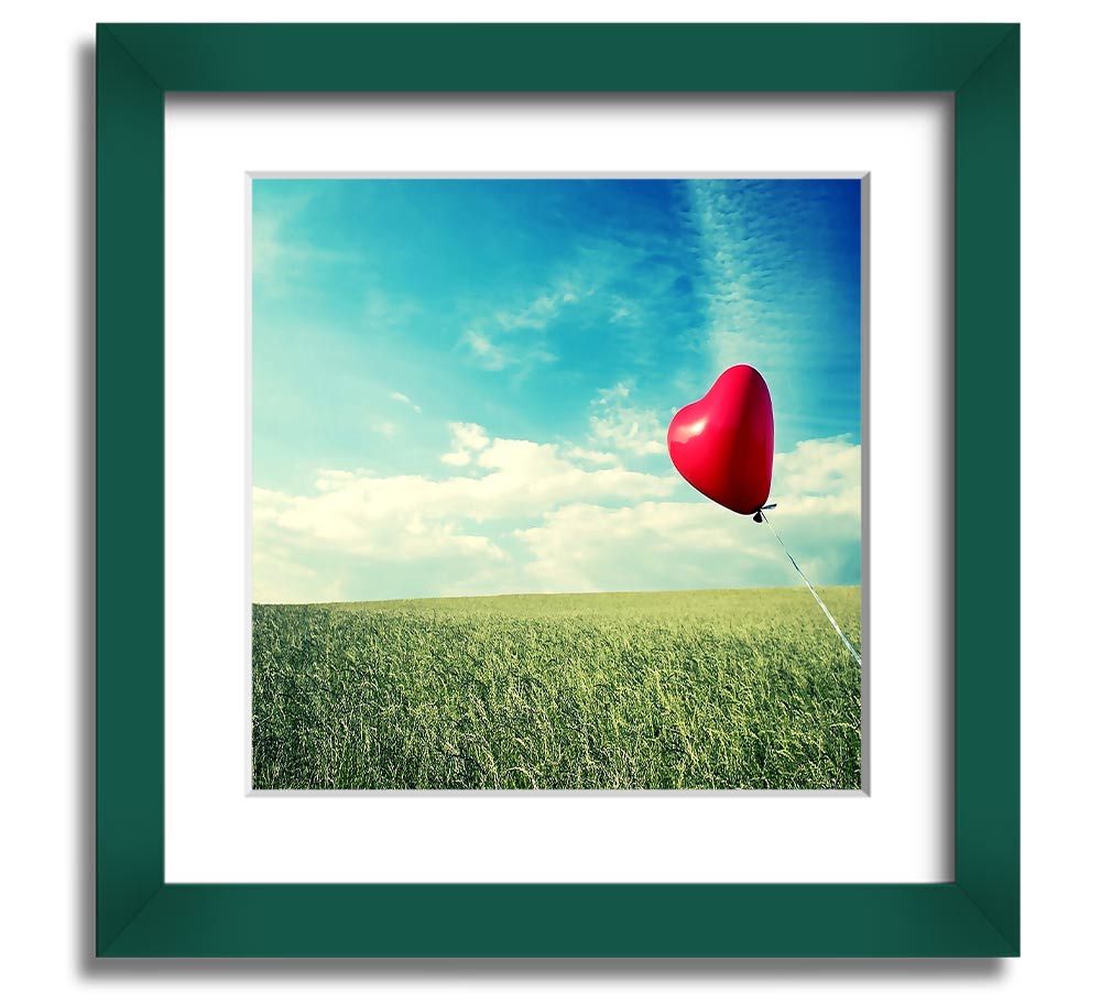 Heart-shaped balloon in field.